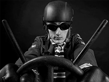 black and white portrait of a model wearing a leather helmet and pretending to drive a car with racing goggles copyright Claude HALET